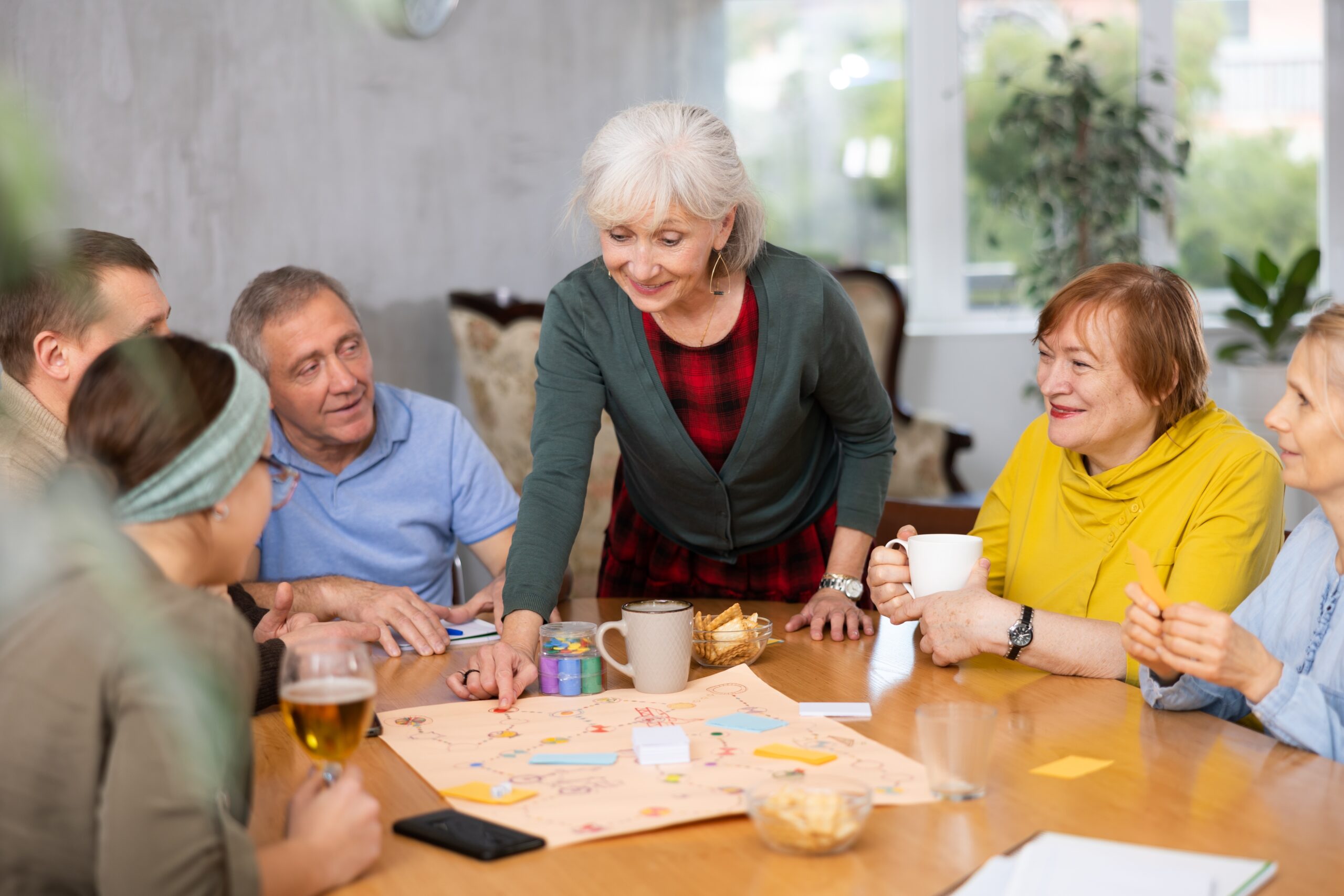 Senior homeowners discussing a reverse mortgage example on gamenight.